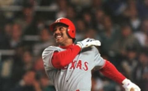 1 Oct 1996: Juan Gonzalez of the Texas Rangers hits a three run home run off New York Yankee pitcher David cone during their 6-2 playoff win at Yankee Stadium in the Bronx, New York. Mandatory Credit: Al Bello/Allsport