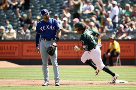 OAKLAND, CA – SEPTEMBER 08: Khris Davis #2 of the Oakland Athletics runs past Joey Gallo #13 of the Texas Rangers as he rounds the bases after he hit a two-run home run in the first inning at Oakland Alameda Coliseum on September 8, 2018 in Oakland, California. (Photo by Ezra Shaw/Getty Images)