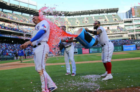 ARLINGTON, TX – MARCH 31: Elvis Andrus #1 of the Texas Rangers and Rougned Odor #12 dump the coolers of water on Asdrubal Cabrera #14 celebrating the win against the Chicago Cubs at Globe Life Park in Arlington on March 31, 2019 in Arlington, Texas. (Photo by Rick Yeatts/Getty Images)