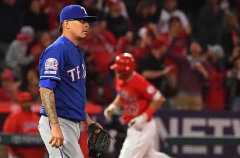 ANAHEIM, CA – APRIL 05: Relief pitcher Jesse Chavez #53 of the Texas Rangers stands on the mound as Mike Trout #27 of the Los Angeles Angels of Anaheim rounds the bases after hitting his second solo home run of the game in the eighth inning at Angel Stadium of Anaheim on April 5, 2019 in Anaheim, California. (Photo by Jayne Kamin-Oncea/Getty Images)