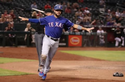 PHOENIX, ARIZONA – APRIL 10: Isiah Kiner-Falefa #9 of the Texas Rangers reacts after safely scoring a run against the Arizona Diamondbacks during the ninth inning of the MLB game at Chase Field on April 10, 2019 in Phoenix, Arizona. (Photo by Christian Petersen/Getty Images)