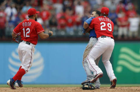 ARLINGTON, TX – MAY 15: Adrian Beltre #29 of the Texas Rangers holds Jose Bautista #19 of the Toronto Blue Jays after being punched by Rougned Odor #12 in the eighth inning at Globe Life Park in Arlington on May 15, 2016 in Arlington, Texas. (Photo by Ronald Martinez/Getty Images)