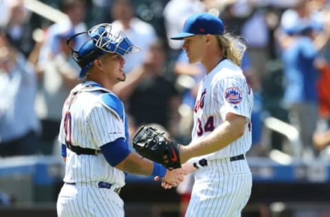 NEW YORK, NEW YORK – MAY 02: Noah Syndergaard #34 of the New York Mets celebrates with Wilson Ramos #40 after pitching a complete game shutout against the Cincinnati Reds at Citi Field on May 02, 2019 in the Queens borough of New York City. New York Mets defeated the Cincinnati Reds 1-0. (Photo by Mike Stobe/Getty Images)