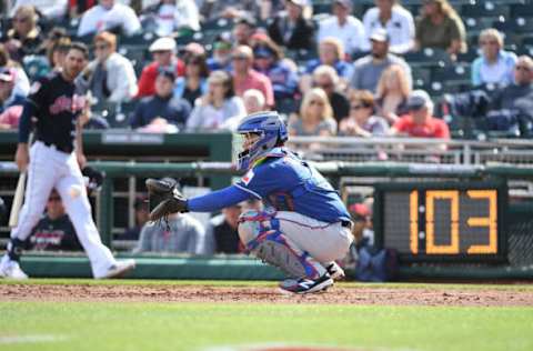 GOODYEAR, AZ – FEBRUARY 25: Jose Trevino #71 of the Texas Rangers catches a warm up pitch as the pitch clock ticks down during the third inning of a spring training game against the Cleveland Indians at Goodyear Ballpark on February 25, 2019 in Goodyear, Arizona. (Photo by Norm Hall/Getty Images)