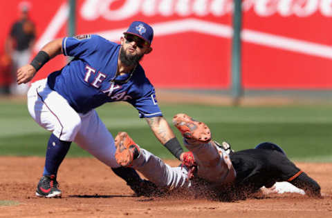 SURPRISE, AZ – MARCH 05: Infielder Rougned Odor #12 of the Texas Rangers tags out Chase d’Arnaud #2 of the San Francisco Giants as he attempts to steal second base during the third inning of the spring training game at Surprise Stadium on March 5, 2018 in Surprise, Arizona. (Photo by Christian Petersen/Getty Images)