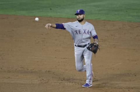 ANAHEIM, CALIFORNIA – APRIL 19: Isiah Kiner-Falefa #9 of the Texas Rangers makes a throw to first base against the Los Angeles Angels during the fifth inning at Angel Stadium of Anaheim on April 19, 2021 in Anaheim, California. (Photo by Michael Owens/Getty Images)