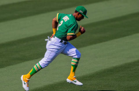 Oct 6, 2020; Los Angeles, California, USA; Oakland Athletics designated hitter Khris Davis (2) warms up prior to game two of the 2020 ALDS against the Houston Astros at Dodger Stadium. Mandatory Credit: Jayne Kamin-Oncea-USA TODAY Sports