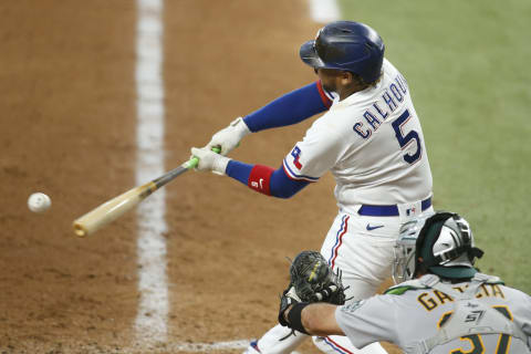 Jun 24, 2021; Arlington, Texas, USA; Texas Rangers designated hitter Willie Calhoun (5) bats in the sixth inning against the Oakland Athletics at Globe Life Field. Mandatory Credit: Tim Heitman-USA TODAY Sports