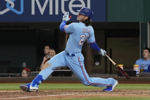 Aug 1, 2021; Arlington, Texas, USA; Texas Rangers designated hitter Jonah Heim (28) follows through on his solo walk-off home run against the Seattle Mariners during the ninth inning of a baseball game at Globe Life Field. Mandatory Credit: Jim Cowsert-USA TODAY Sports