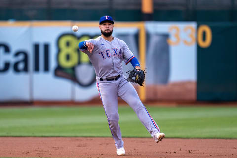 Aug 6, 2021; Oakland, California, USA; Texas Rangers third baseman Isiah Kiner-Falefa (9) throw out Oakland Athletics right fielder Mark Canha (not pictured) during the first inning at RingCentral Coliseum. Mandatory Credit: Neville E. Guard-USA TODAY Sports