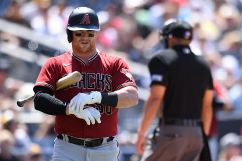 Aug 8, 2021; San Diego, California, USA; Arizona Diamondbacks right fielder Kole Calhoun (56) adjusts his gloves during an at-bat during the sixth inning against the San Diego Padres at Petco Park. Mandatory Credit: Orlando Ramirez-USA TODAY Sports