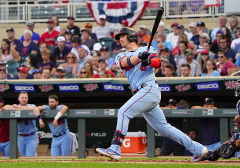 Aug 14, 2021; Minneapolis, Minnesota, USA; Minnesota Twins catcher Mitch Garver (8) hits a stand-up RBI-double off of Tampa Bay Rays starting pitcher Michael Wacha (52) during the first inning at Target Field. Mandatory Credit: Nick Wosika-USA TODAY Sports