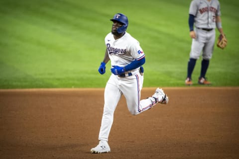 Aug 28, 2021; Arlington, Texas, USA; Texas Rangers right fielder Adolis Garcia (53) rounds the bases after hitting a home run against the Houston Astros during the sixth inning at Globe Life Field. Mandatory Credit: Jerome Miron-USA TODAY Sports