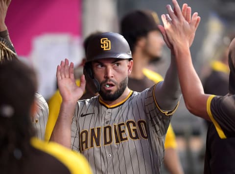 Aug 28, 2021; Anaheim, California, USA; San Diego Padres first baseman Eric Hosmer (30) is greeted in the dugout after scoring a run in the fourth inning against the Los Angeles Angels at Angel Stadium. Mandatory Credit: Jayne Kamin-Oncea-USA TODAY Sports