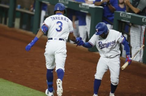 Aug 31, 2021; Arlington, Texas, USA; Texas Rangers center fielder Leody Taveras (3) celebrates with designated hitter Yonny Hernandez (65) after hitting a home run against the Colorado Rockies in the fourth inning at Globe Life Field. Mandatory Credit: Tim Heitman-USA TODAY Sports