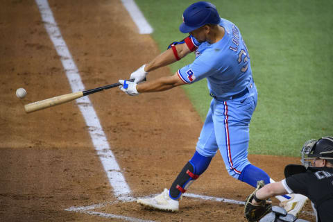 Sep 19, 2021; Arlington, Texas, USA; Texas Rangers first baseman Nathaniel Lowe (30) hits a lead off double against the Chicago White Sox during the second inning at Globe Life Field. Mandatory Credit: Jerome Miron-USA TODAY Sports