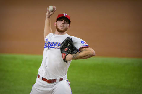 Sep 28, 2021; Arlington, Texas, USA; Texas Rangers starting pitcher A.J. Alexy (62) pitches against the Los Angeles Angels during the first inning at Globe Life Field. Mandatory Credit: Jerome Miron-USA TODAY Sports