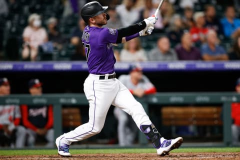 Sep 28, 2021; Denver, Colorado, USA; Colorado Rockies shortstop Trevor Story (27) hits a solo home run against the Washington Nationals in the fifth inning at Coors Field. Mandatory Credit: Isaiah J. Downing-USA TODAY Sports