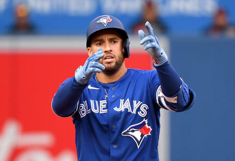 Oct 2, 2021; Toronto, Ontario, CAN; Toronto Blue Jays center fielder George Springer (4) reacts after hitting a double against Baltimore Orioles in the eighth inning at Rogers Centre. Mandatory Credit: Dan Hamilton-USA TODAY Sports