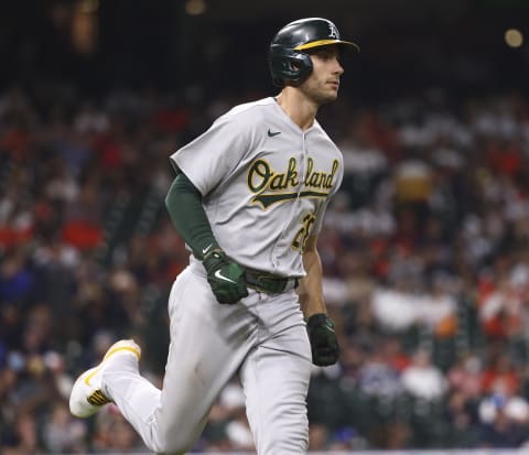 Oct 2, 2021; Houston, Texas, USA; Oakland Athletics first baseman Matt Olson (28) runs to first base after hitting a a single against the Houston Astros during the seventh inning at Minute Maid Park. Mandatory Credit: Troy Taormina-USA TODAY Sports