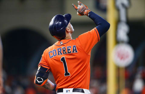 Oct 16, 2021; Houston, Texas, USA; Houston Astros shortstop Carlos Correa (1) reacts after hitting a single against the Boston Red Sox during the fourth inning in game two of the 2021 ALCS at Minute Maid Park. Mandatory Credit: Troy Taormina-USA TODAY Sports