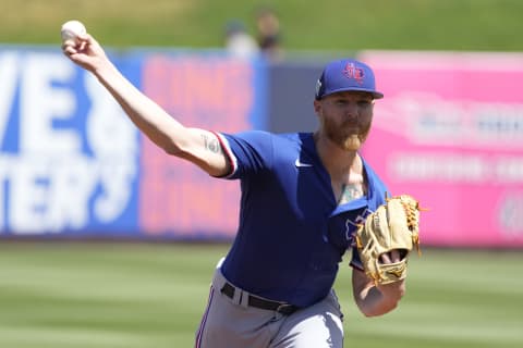 Apr 3, 2022; Phoenix, Arizona, USA; Texas Rangers starting pitcher Jon Gray (22) throws a pitch against the Milwaukee Brewers in the first inning during a spring training game at American Family Fields of Phoenix. Mandatory Credit: Rick Scuteri-USA TODAY Sports