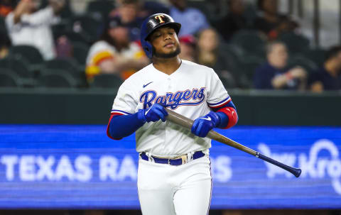 Apr 26, 2022; Arlington, Texas, USA; Texas Rangers designated hitter Willie Calhoun (4) reacts after striking out during the seventh inning against the Houston Astros at Globe Life Field. Mandatory Credit: Kevin Jairaj-USA TODAY Sports