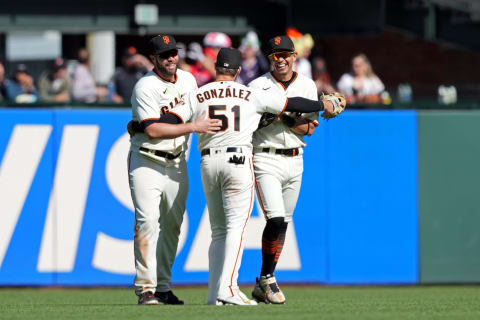 Apr 30, 2022; San Francisco, California, USA; San Francisco Giants right fielder Luis Gonzalez (51) celebrates with left fielder Darin Ruf (33) and center fielder Mauricio Dubon (1) after defeating the Washington Nationals at Oracle Park. Mandatory Credit: Darren Yamashita-USA TODAY Sports