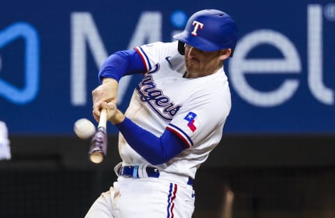 May 12, 2022; Arlington, Texas, USA; Texas Rangers third baseman Brad Miller (13) hits a home run during the seventh inning against the Kansas City Royals at Globe Life Field. Mandatory Credit: Kevin Jairaj-USA TODAY Sports