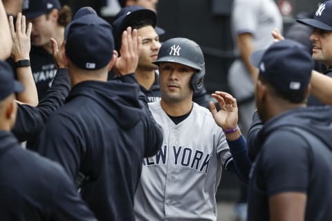 May 15, 2022; Chicago, Illinois, USA; New York Yankees third baseman Isiah Kiner-Falefa (12) celebrates with teammates after scoring against the Chicago White Sox during the second inning at Guaranteed Rate Field. Mandatory Credit: Kamil Krzaczynski-USA TODAY Sports