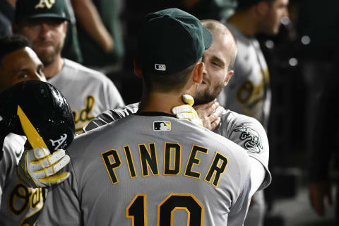 Jul 29, 2022; Chicago, Illinois, USA; Oakland Athletics first baseman Seth Brown (15) celebrates in the dugout with Oakland Athletics left fielder Chad Pinder (10) after he hits a home run against the Chicago White Sox during the sixth inning at Guaranteed Rate Field. Mandatory Credit: Matt Marton-USA TODAY Sports