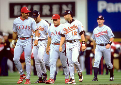 Jul 7, 1998; Denver, CO, USA; FILE PHOTO; (From left to right) American League outfielder Juan Gonzalez (19) of the Texas Rangers, third baseman Cal Ripken Jr. (8) of the Baltimore Orioles, catcher Ivan Rodriguez (7) of the Texas Rangers and second baseman Roberto Alomar (12) of the Baltimore Orioles on the field during the 1998 MLB All-Star Game at Coors Field. Mandatory Credit: V.J. Lovero-USA TODAY NETWORK