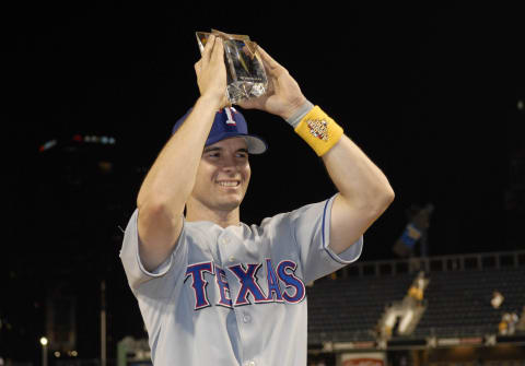 Jul 11, 2006; Pittsburgh, PA, USA; American League All-Star second basemen Michael Young holds up the Most Valuable Player trophy after the AL beat the National League 3-2 in the 2006 All-Star Game at PNC Park in Pittsburgh, PA. Mandatory Credit: Scott Rovak-USA TODAY Sports Copyright © 2006 Scott Rovak