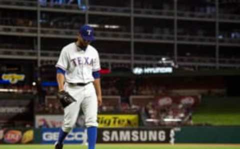 Aug 26, 2016; Arlington, TX, USA; Texas Rangers relief pitcher Dario Alvarez (39) walks off the field during the game against the Cleveland Indians at Globe Life Park in Arlington. The Indians defeat the Rangers 12-1. Mandatory Credit: Jerome Miron-USA TODAY Sports