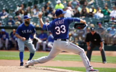 Apr 19, 2017; Oakland, CA, USA; Texas Rangers starting pitcher Martin Perez (33) pitches the ball against the Oakland Athletics during the first inning at Oakland Coliseum. Mandatory Credit: Stan Szeto-USA TODAY Sports