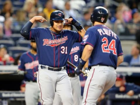 May 30, 2014; Bronx, NY, USA; Minnesota Twins right fielder Oswaldo Arcia (31) and third baseman Trevor Plouffe (24) celebrate Plouffe