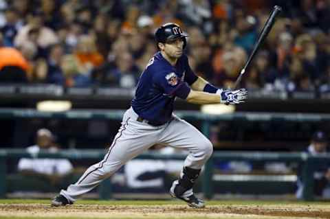 Sep 27, 2014; Detroit, MI, USA; Minnesota Twins second baseman Brian Dozier (2) hits an RBI single in the fifth inning against the Detroit Tigers at Comerica Park. Mandatory Credit: Rick Osentoski-USA TODAY Sports