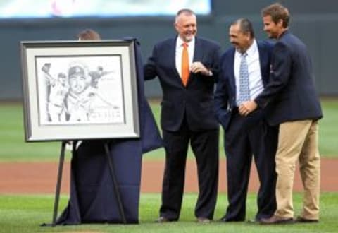 Jun 14, 2013; Minneapolis, MN, USA; (left to right) Bert Blyleven, Eddie Guardado and Brad Radke take a look at Eddie Guardado