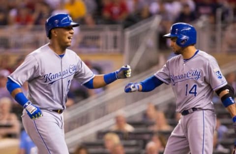 Jun 9, 2015; Minneapolis, MN, USA; Kansas City Royals catcher Salvador Perez (13) celebrates with second baseman Omar Infante (14) after hitting a home run in the ninth inning against the Minnesota Twins at Target Field. The Royals won 2-0. Mandatory Credit: Brad Rempel-USA TODAY Sports