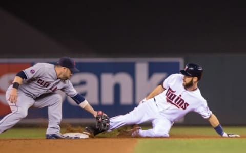 Sep 22, 2015; Minneapolis, MN, USA; Minnesota Twins first baseman Joe Mauer (7) doubles in the third inning against the Cleveland Indians second baseman Jason Kipnis (22) at Target Field. Mandatory Credit: Brad Rempel-USA TODAY Sports