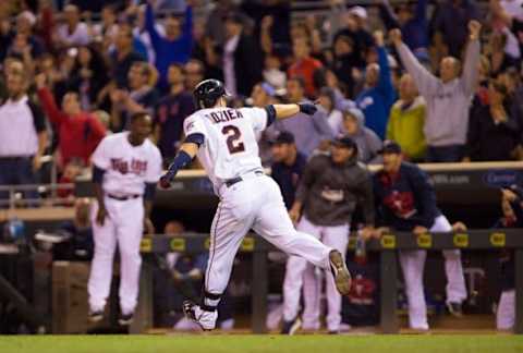 Jul 6, 2015; Minneapolis, MN, USA; Minnesota Twins second baseman Brian Dozier (2) points to the dugout after his walk off home run in the tenth inning against the Baltimore Orioles at Target Field. The Minnesota Twins beat the Baltimore Orioles 4-2. Mandatory Credit: Brad Rempel-USA TODAY Sports