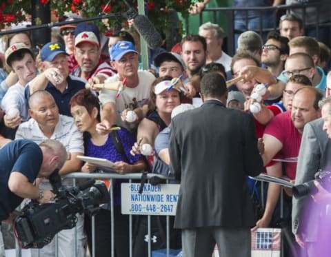 Jul 25, 2015; Cooperstown, NY, USA; Hall of Famer Rod Carew signs autographs for fans at National Baseball Hall of Fame. Mandatory Credit: Gregory J. Fisher-USA TODAY Sports