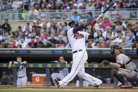 Jul 7, 2015; Minneapolis, MN, USA; Minnesota Twins designated hitter Miguel Sano (22) hits a home run in the first inning against the Baltimore Orioles at Target Field. Mandatory Credit: Jesse Johnson-USA TODAY Sports