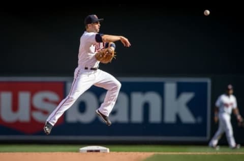 Sep 19, 2015; Minneapolis, MN, USA; Minnesota Twins second baseman Brian Dozier (2) fields a ball hit by the Los Angeles Angels in game one of a doubleheader at Target Field. The Angels win 4-3 in 12 innings. Mandatory Credit: Bruce Kluckhohn-USA TODAY Sports