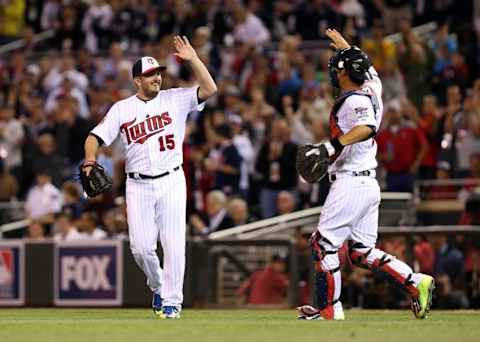 Jul 15, 2014; Minneapolis, MN, USA; American League pitcher Glen Perkins (15) celebrates with Kurt Suzuki (8) of the Minnesota Twins after defeating the National League 5-3 in the 2014 MLB All Star Game at Target Field. Mandatory Credit: Jesse Johnson-USA TODAY Sports