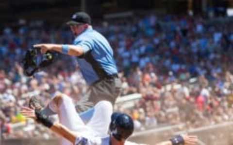 Jun 19, 2016; Minneapolis, MN, USA; Minnesota Twins first baseman Trevor Plouffe (24) slides home safely in the sixth inning against New York Yankees catcher Brian McCann (34) at Target Field. Mandatory Credit: Brad Rempel-USA TODAY Sports