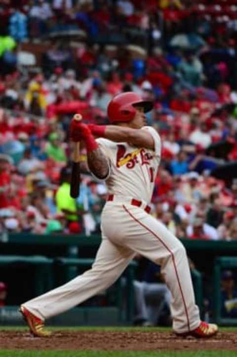 Jul 2, 2016; St. Louis, MO, USA; St. Louis Cardinals second baseman Kolten Wong (16) hits a two run triple off of Milwaukee Brewers starting pitcher Jimmy Nelson (not pictured) during the fourth inning at Busch Stadium. Mandatory Credit: Jeff Curry-USA TODAY Sports