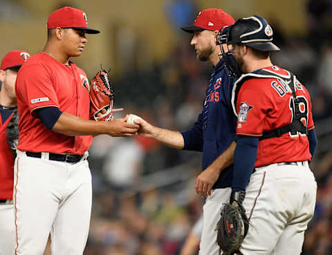 MINNEAPOLIS, MN – SEPTEMBER 06: Manager Rocco Baldelli #5 of the Minnesota Twins teaks the ball from Brusdar Graterol #51 as catcher Mitch Garver #18 looks on during the eleventh inning of the game against the Cleveland Indians on September 6, 2019 at Target Field in Minneapolis, Minnesota. The Indians defeated the Twins 6-2 in eleven innings. (Photo by Hannah Foslien/Getty Images)