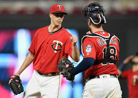 MINNEAPOLIS, MINNESOTA – SEPTEMBER 16: Taylor Rogers #55 and Mitch Garver #18 of the Minnesota Twins celebrate defeating the Chicago White Sox after the game at Target Field on September 16, 2019 in Minneapolis, Minnesota. The Twins defeated the White Sox 5-3. (Photo by Hannah Foslien/Getty Images)