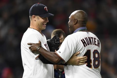 Former Minnesota Twins Joe Mauer and Torii Hunter (Photo by Hannah Foslien/Getty Images)